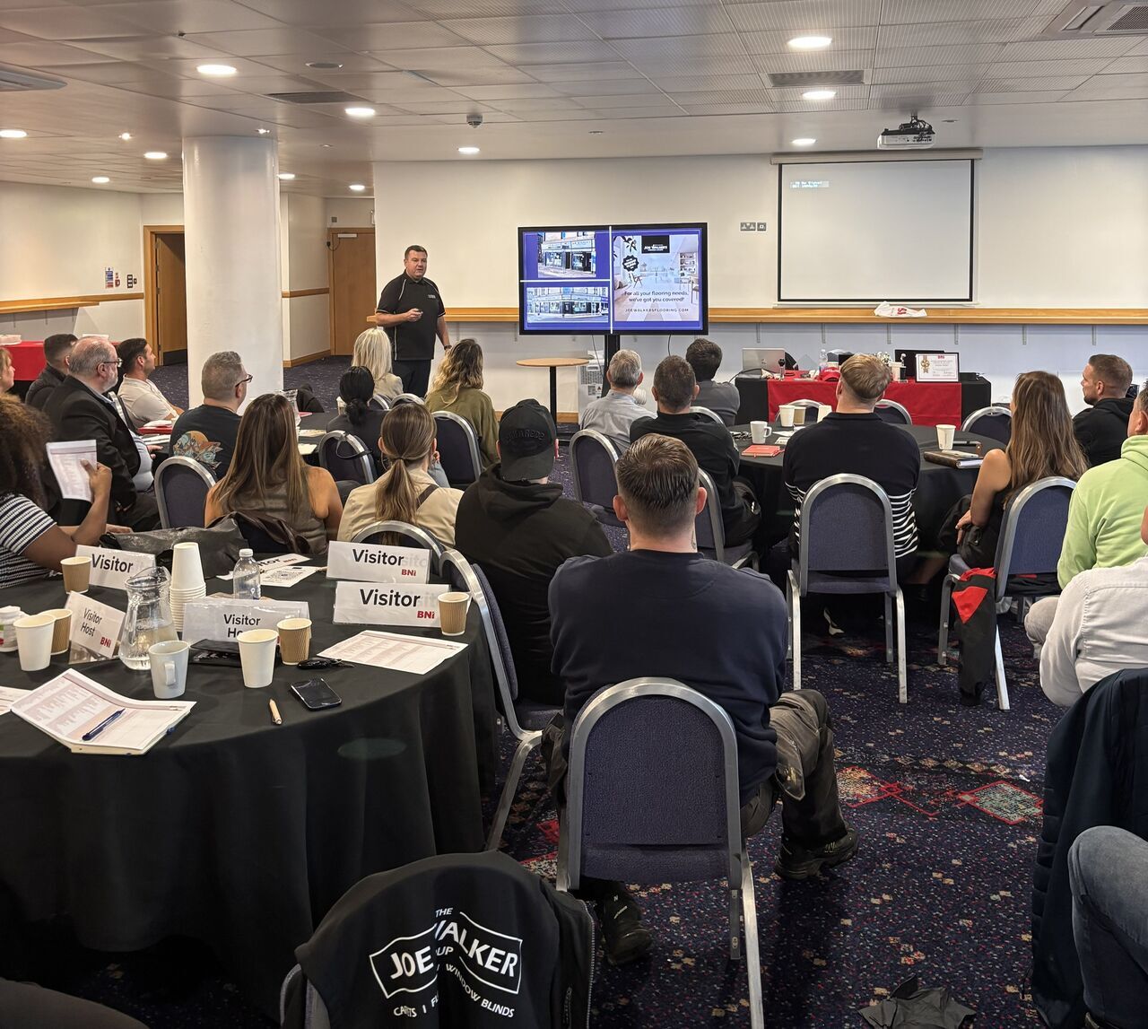 Joe Walker at Hampden Stadium in Glasgow talking carpets, flooring and window blinds to a packed conference room